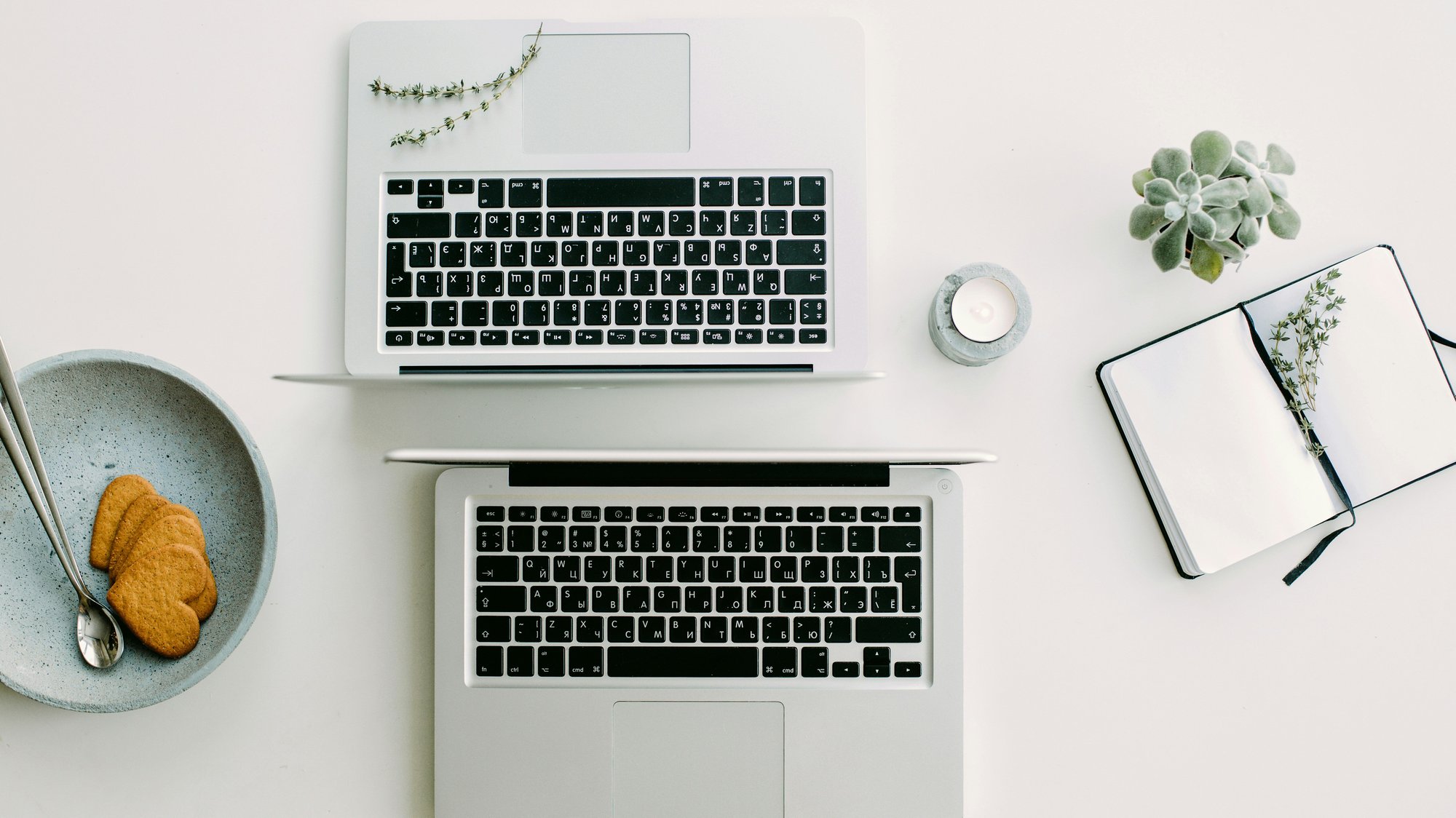 overhead view of laptops on a desk facing back-to-back